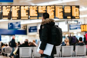 Man looking at a departure board