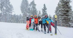 Group of people with skis on slope