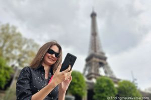Jess using phone in Paris by_